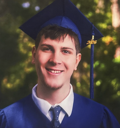 Christopher in cap and gown