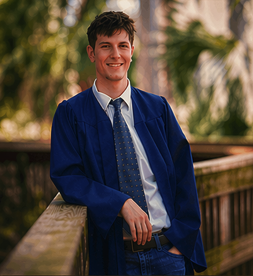 Christopher holding 2026 tassel